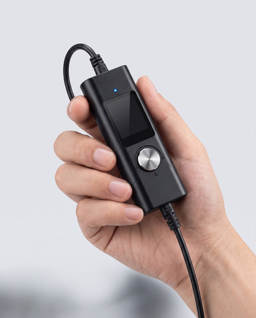 Compact endoscope control module held in hand for scale